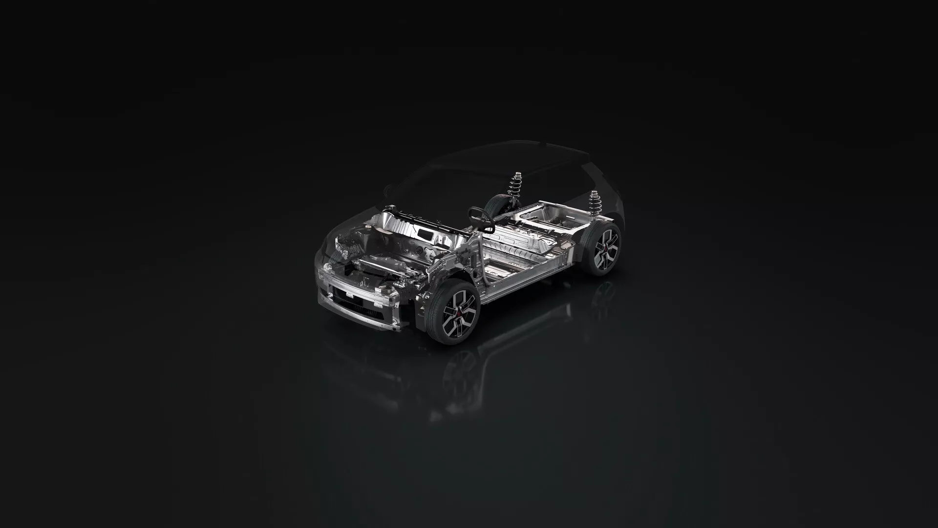 Modèle transparent de la Renault R5 2024 présentant la conception mécanique interne sur une surface foncée réfléchissante, vue sous un angle élevé