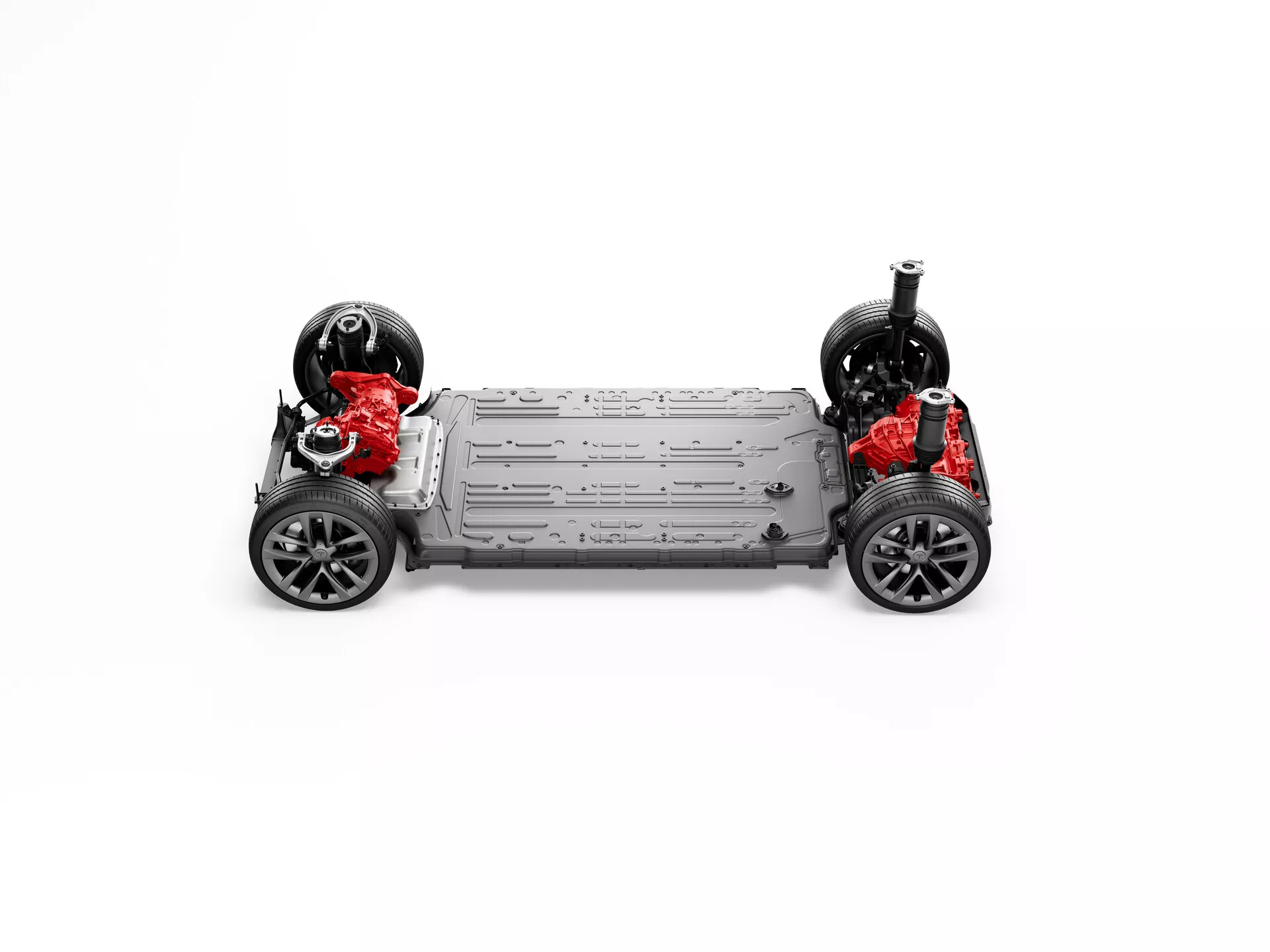 Vue symétrique de haut en bas du châssis de la Tesla Model S 2016 (1ère génération restylée) véhicule électrique, montrant quatre roues, arbres, éléments de suspension indépendante, grand pack batterie central et moteurs électriques rouges doubles suggérant des capacités à traction intégrale, sur un fond blanc neutre.