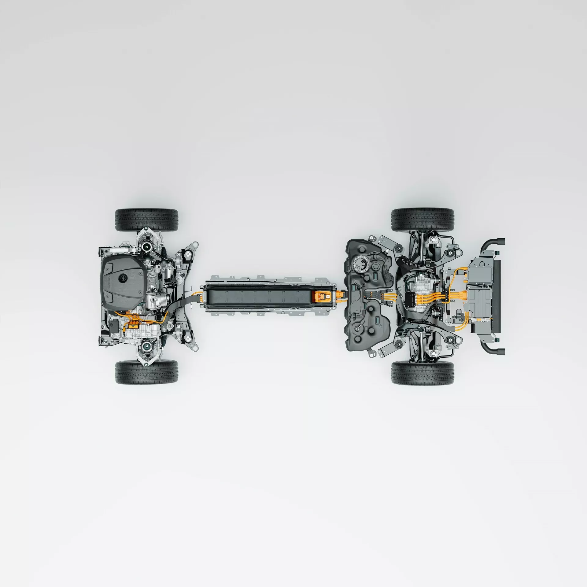 Vue aérienne d'un châssis de véhicule électrique (VE) démonté, mettant en évidence des caractéristiques technologiques clés, y compris quatre roues détachées avec des assemblages de suspension, un pack batterie haute tension central, des moteurs électriques et des composants de transmission aux deux extrémités, et des câbles haute tension orange visibles. La disposition suggère un système de traction intégrale, avec un fond neutre mettant en valeur les composants de manière propre et illustrative.